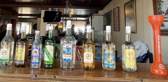 Cuello's bottles lined up on a bar