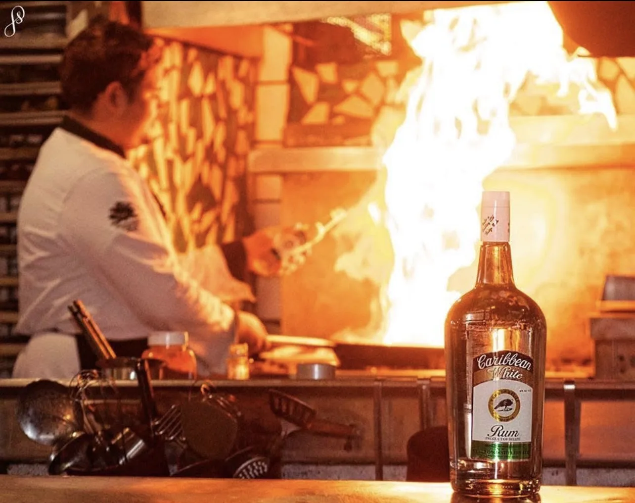 Flambé preparation photographed with Cuello's Caribbean White Rum