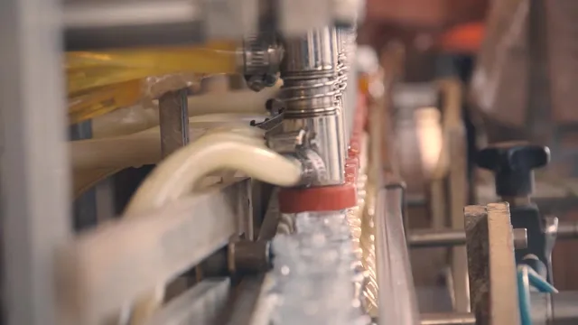 Close-up of bottles being filled at the distillery